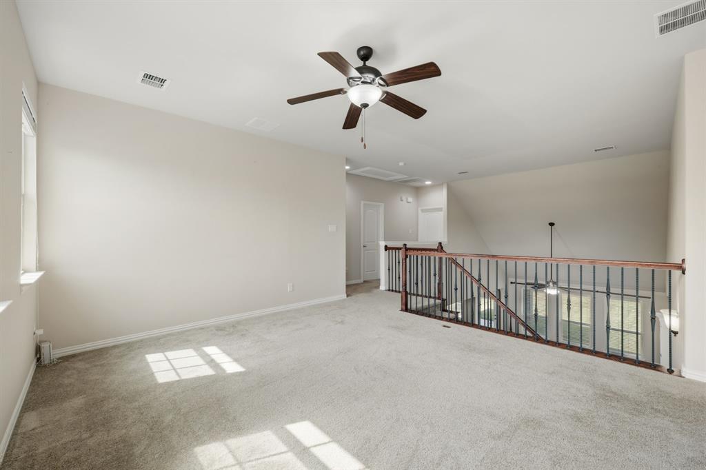 12809 Spring Hill Drive Frisco, TX 75035 - Photo 34 of 37 a view of an empty room and chandelier fan