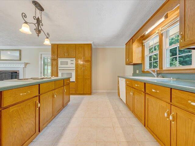 5828 Henry Road Henry, VA 24102 - Photo 13 of 58 a large kitchen with kitchen island granite countertop a large window