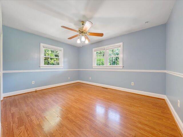 5828 Henry Road Henry, VA 24102 - Photo 18 of 58 an empty room with windows and ceiling fan