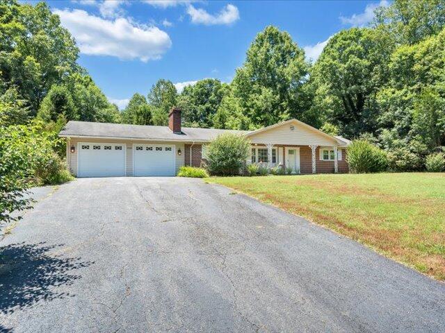 5828 Henry Road Henry, VA 24102 - Photo 45 of 58 a view of house with yard and trees in the background