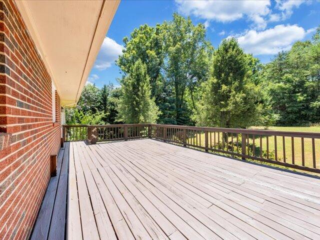 5828 Henry Road Henry, VA 24102 - Photo 48 of 58 a view of balcony with wooden floor and fence