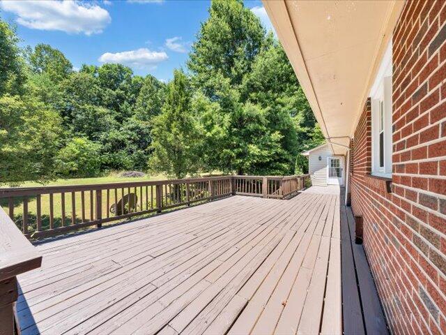 5828 Henry Road Henry, VA 24102 - Photo 49 of 58 a view of balcony with wooden floor and fence