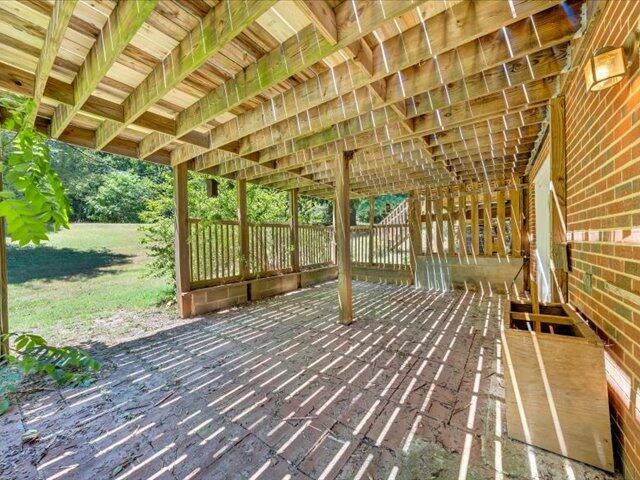 5828 Henry Road Henry, VA 24102 - Photo 52 of 58 a porch with a wooden floor