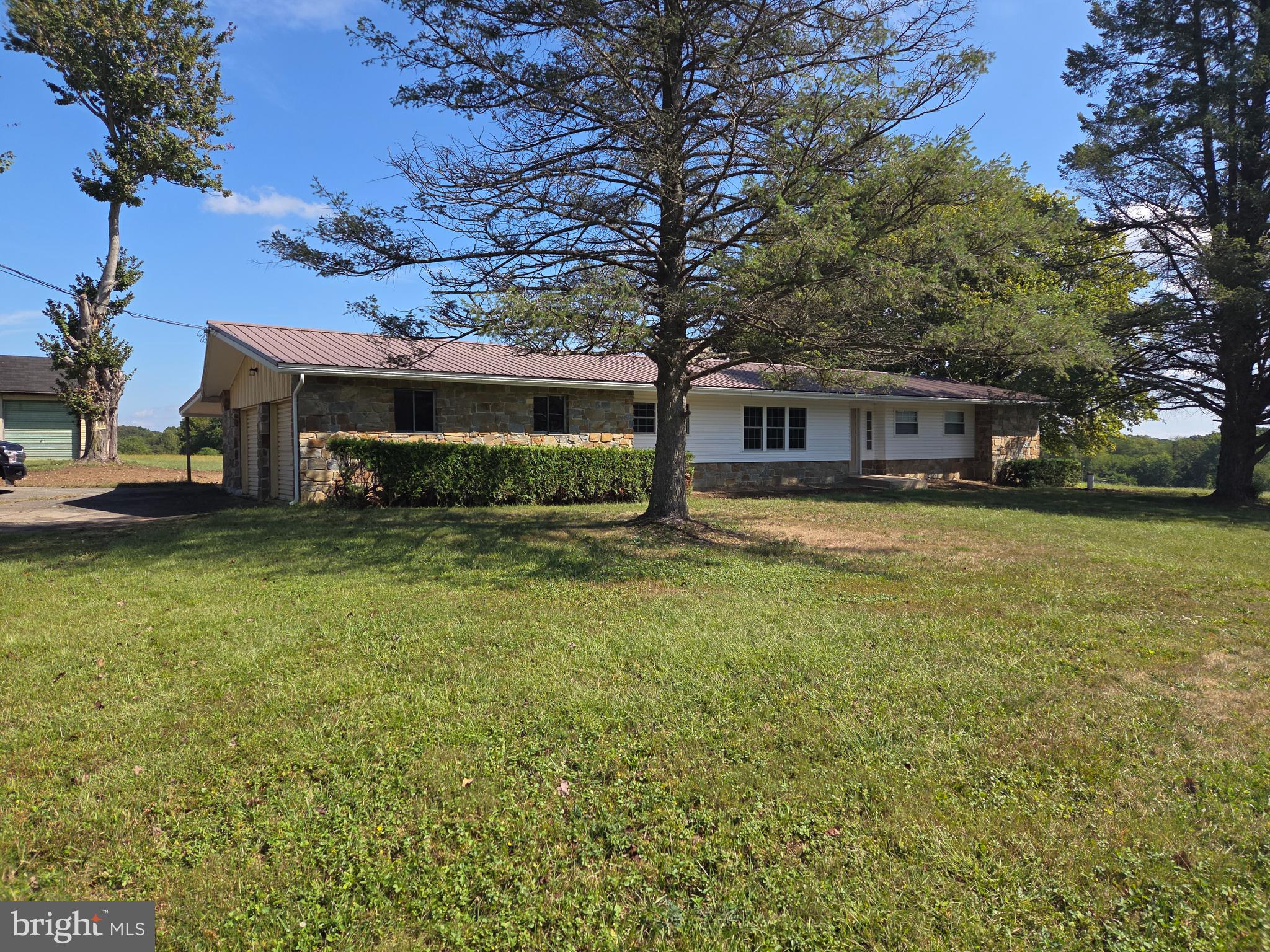 2264 Blue Ball Road Elkton, MD 21921 - Photo 2 of 27 a view of a house with a big yard and large trees