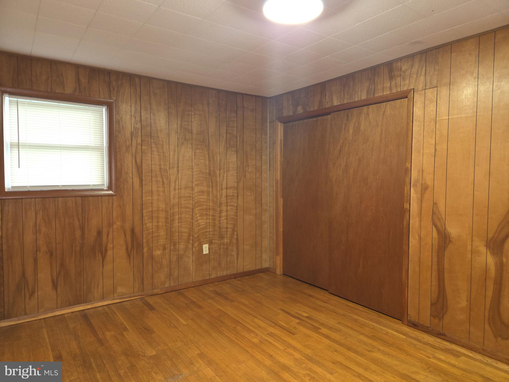 2264 Blue Ball Road Elkton, MD 21921 - Photo 21 of 27 a view of an empty room with wooden floor and a window