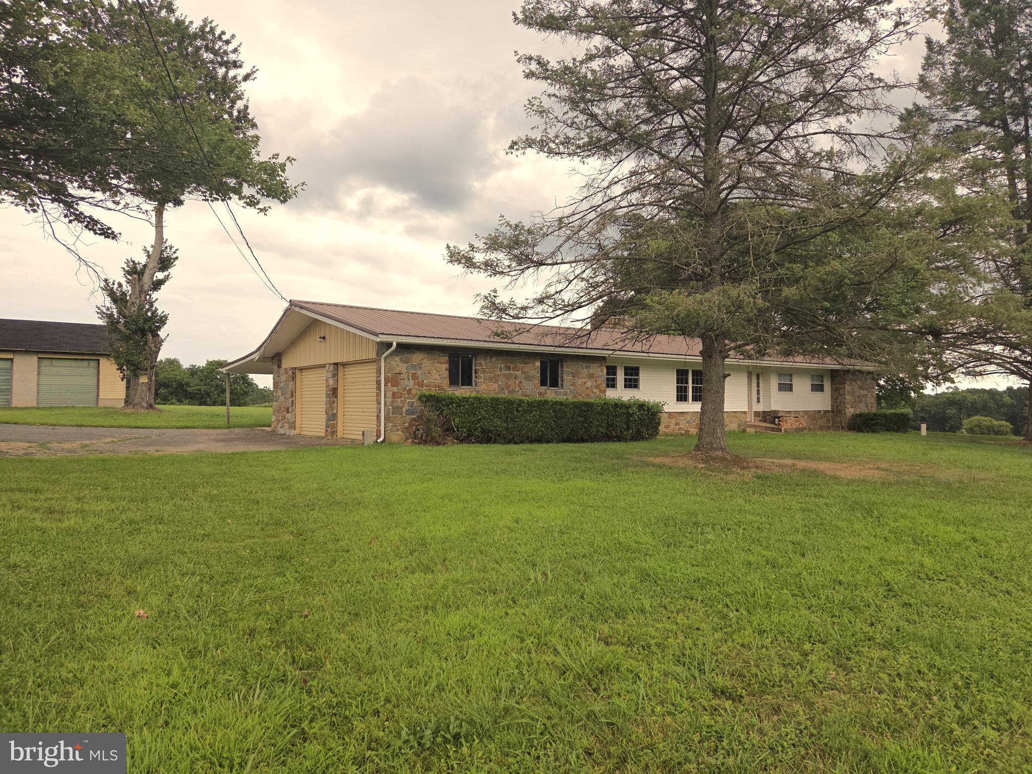 2264 Blue Ball Road Elkton, MD 21921 - Photo 5 of 27 a front view of a house with a garden