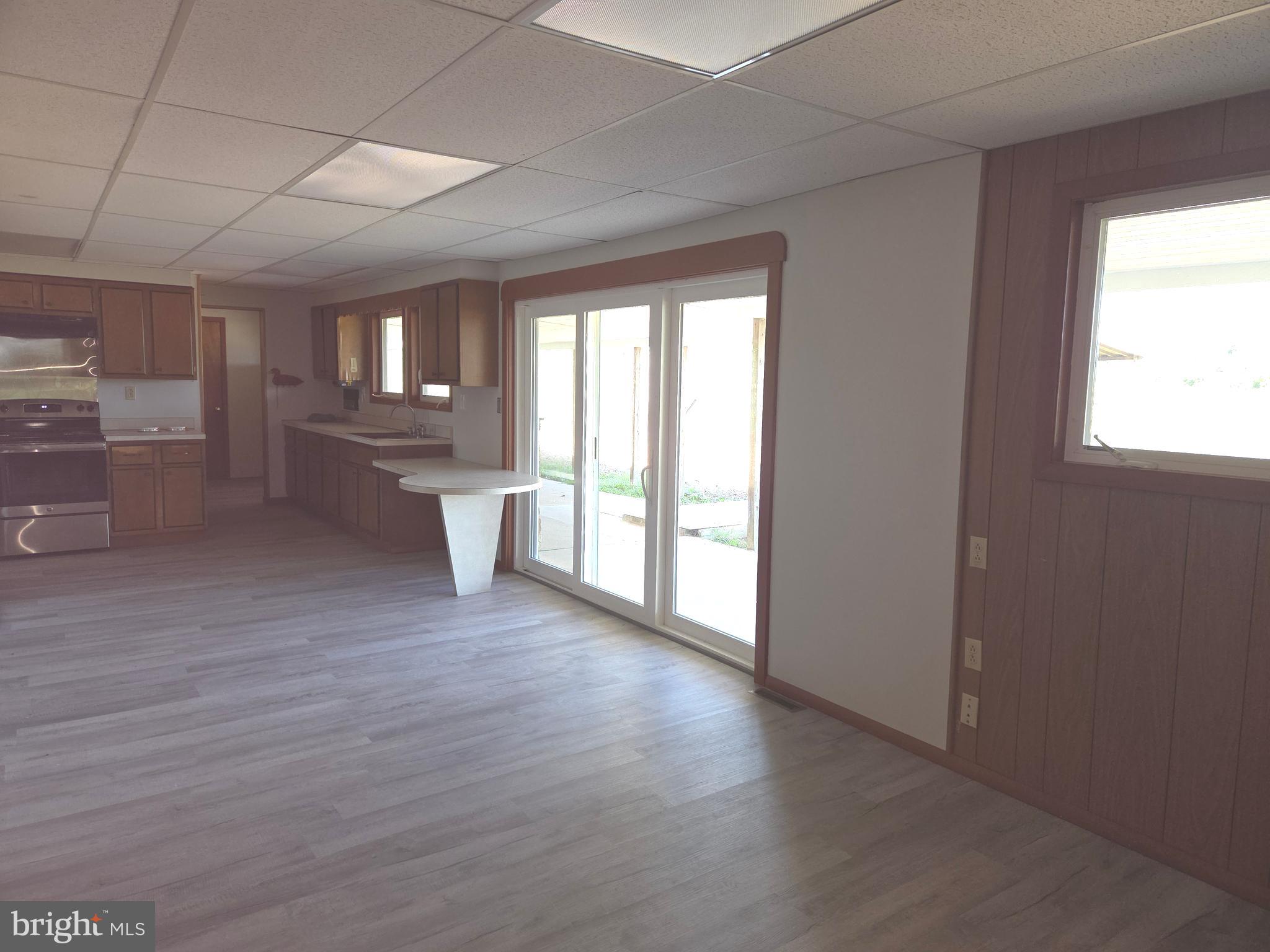 2264 Blue Ball Road Elkton, MD 21921 - Photo 9 of 27 a view of a big room with wooden floor and windows