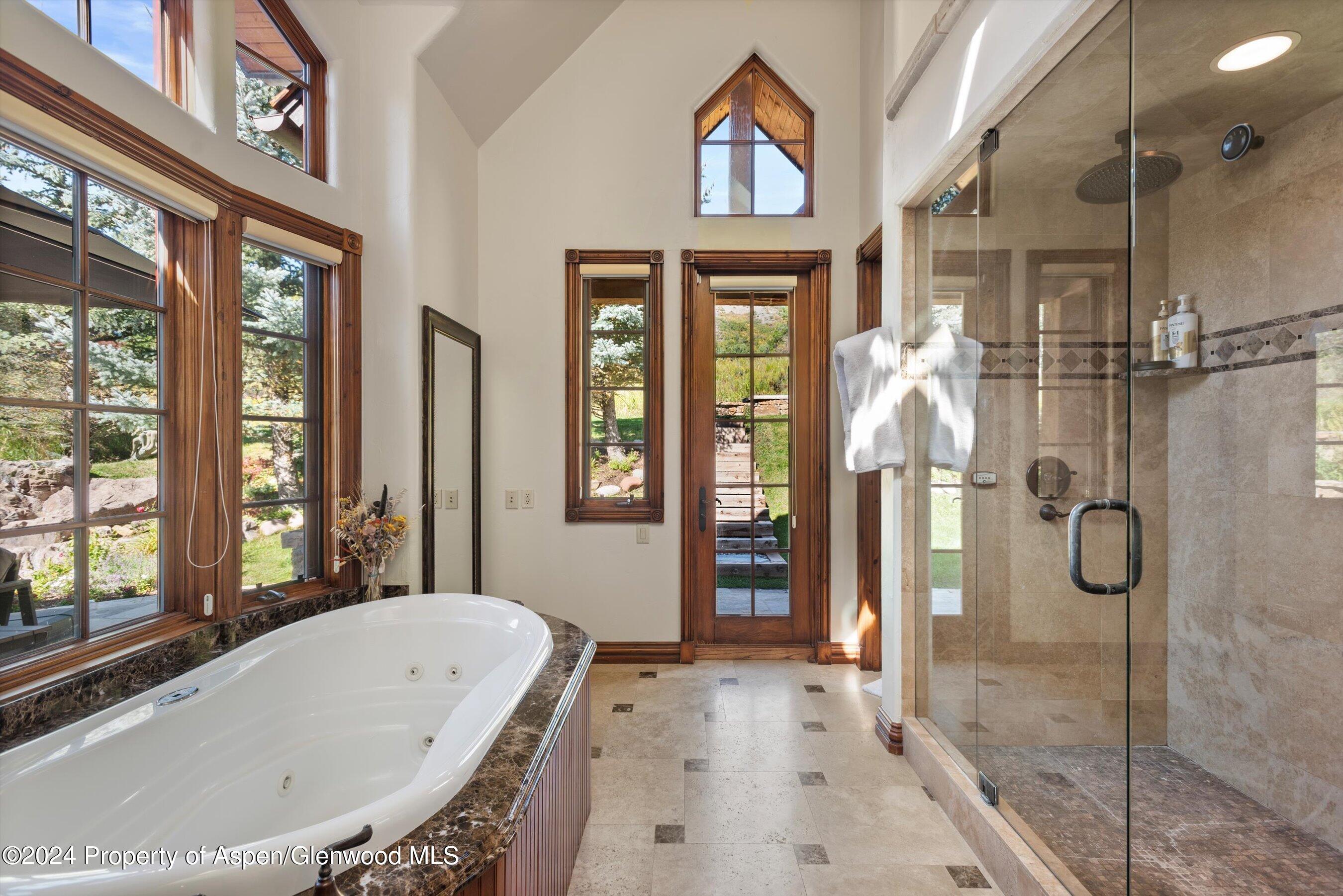71 Meadow Road Snowmass Village, CO 81615 - Photo 15 of 48 a bathroom with a bathtub and a shower