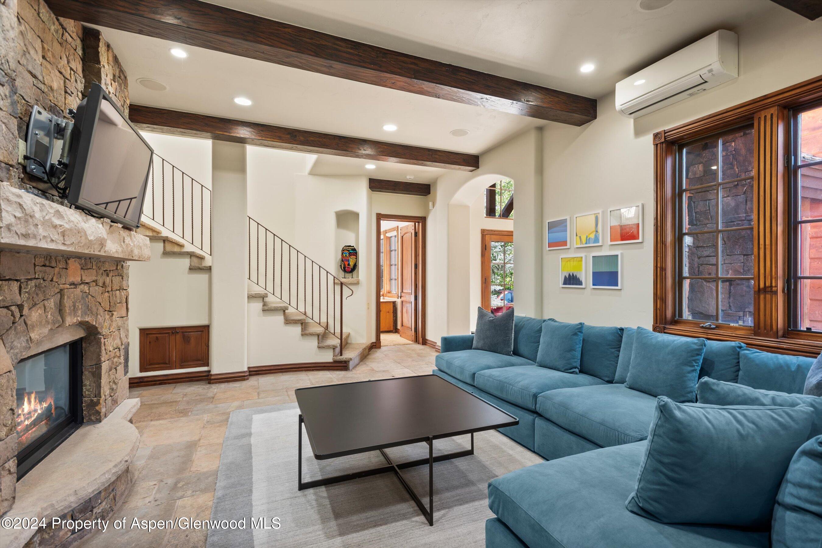 71 Meadow Road Snowmass Village, CO 81615 - Photo 17 of 48 a living room with furniture and a fireplace
