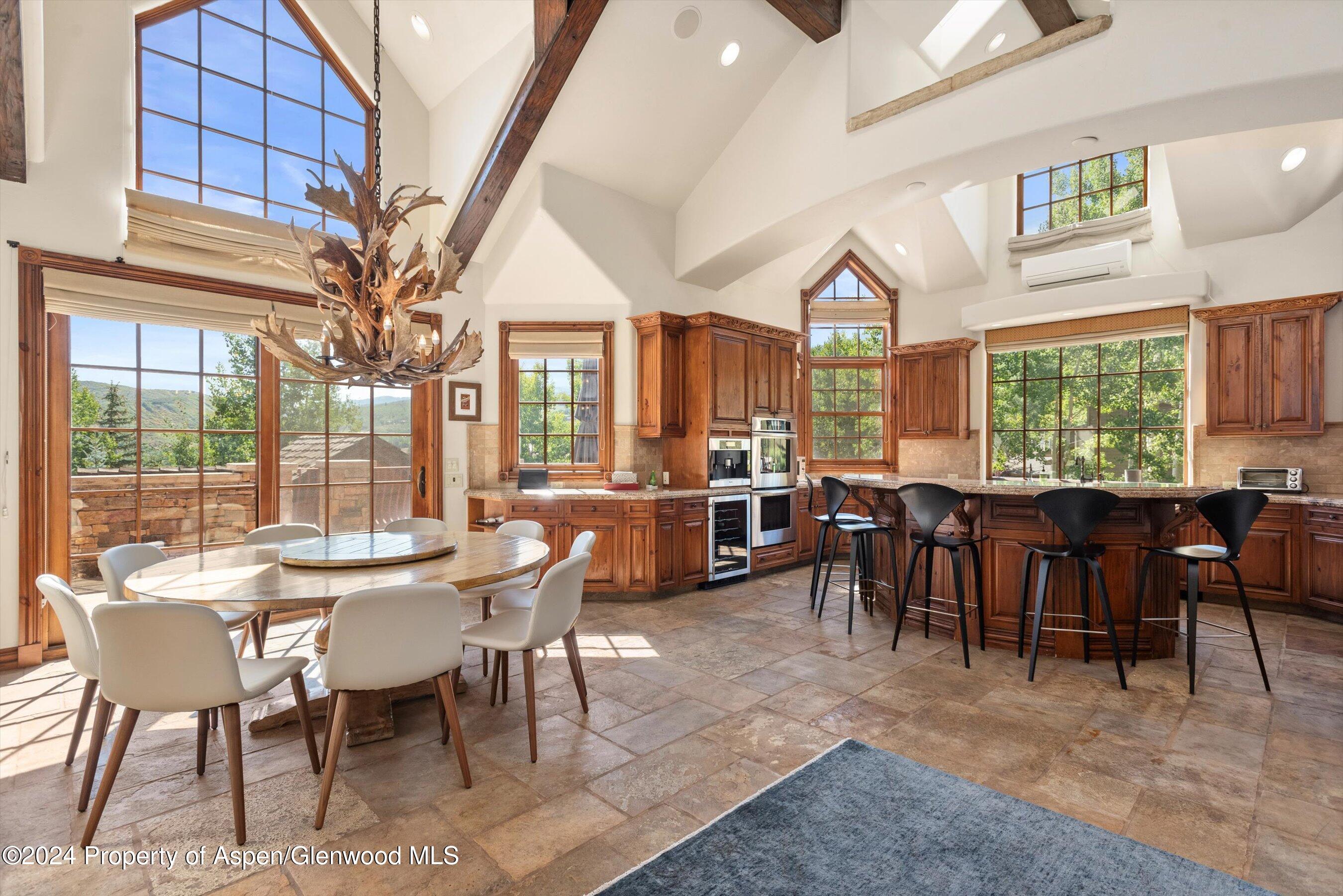 71 Meadow Road Snowmass Village, CO 81615 - Photo 2 of 48 a view of a dining room with furniture window and outside view