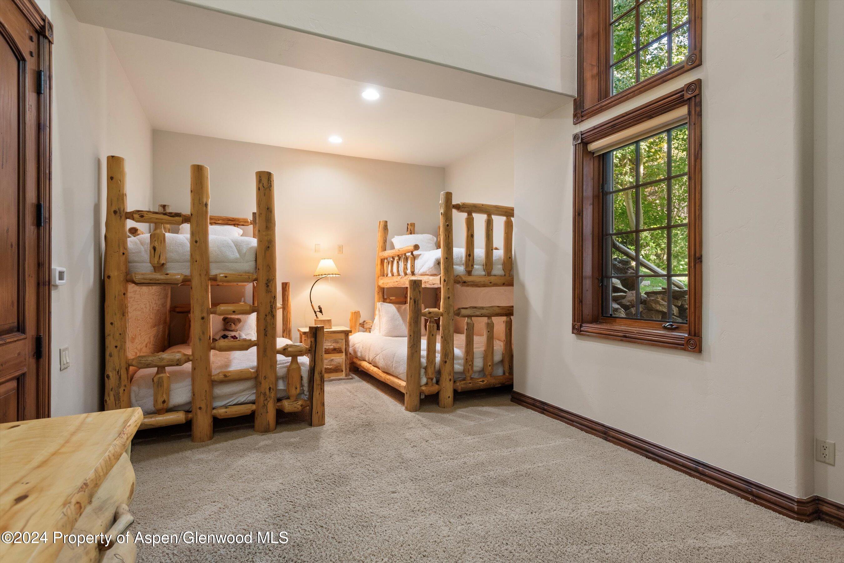 71 Meadow Road Snowmass Village, CO 81615 - Photo 22 of 48 a living room with furniture and a large window