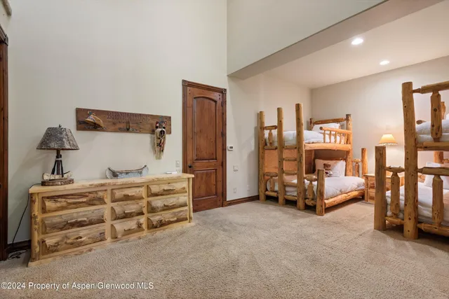 a bedroom with furniture and natural light