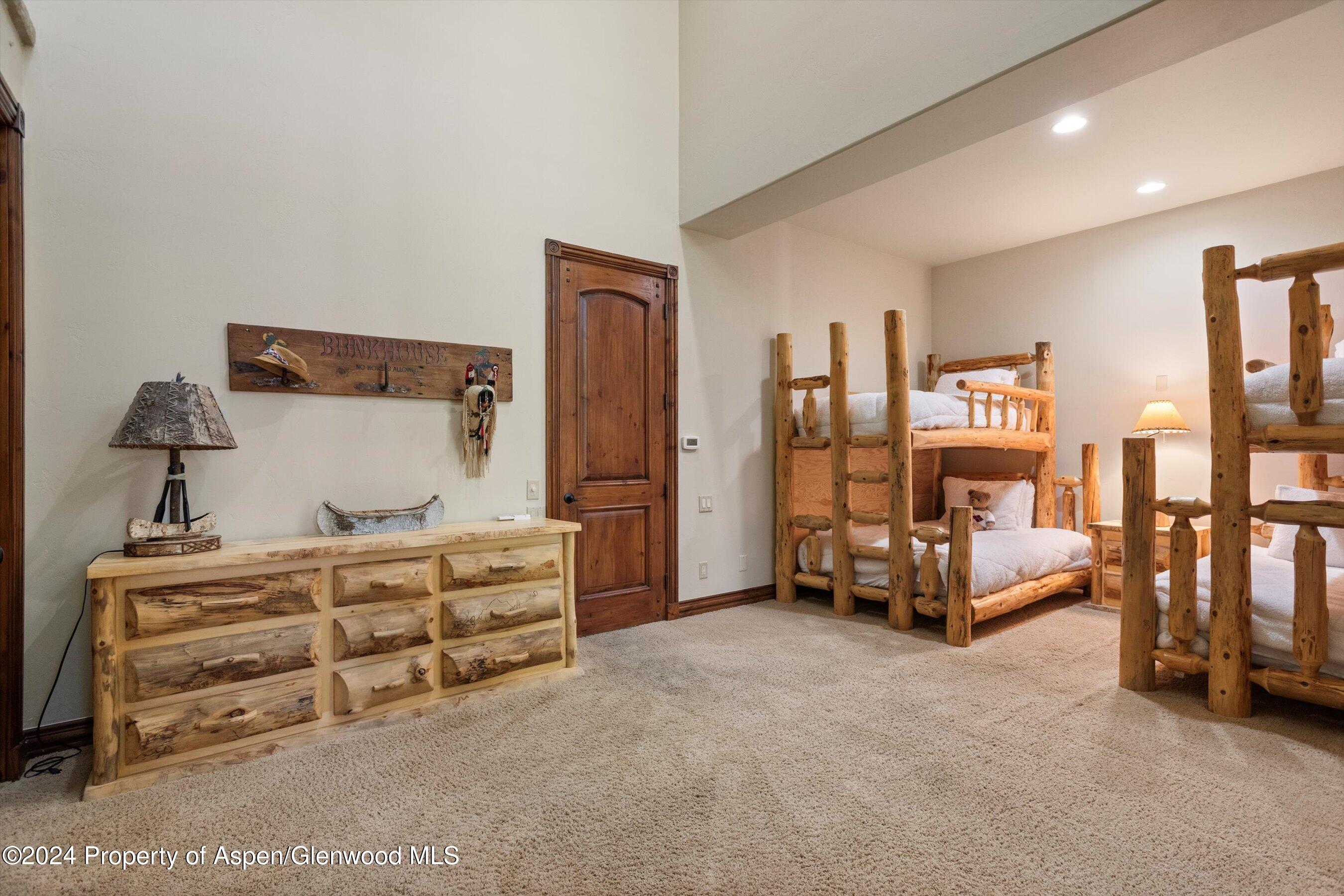 71 Meadow Road Snowmass Village, CO 81615 - Photo 23 of 48 a bedroom with furniture and natural light