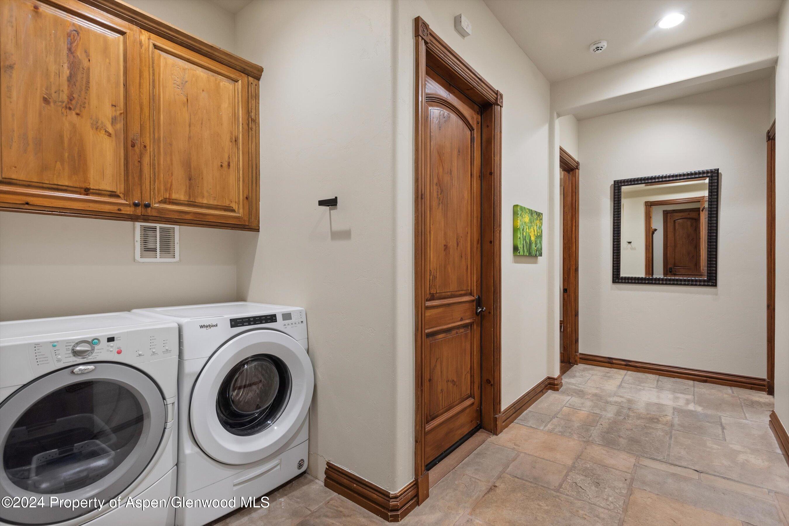 71 Meadow Road Snowmass Village, CO 81615 - Photo 25 of 48 a view of a hallway with washer and dryer