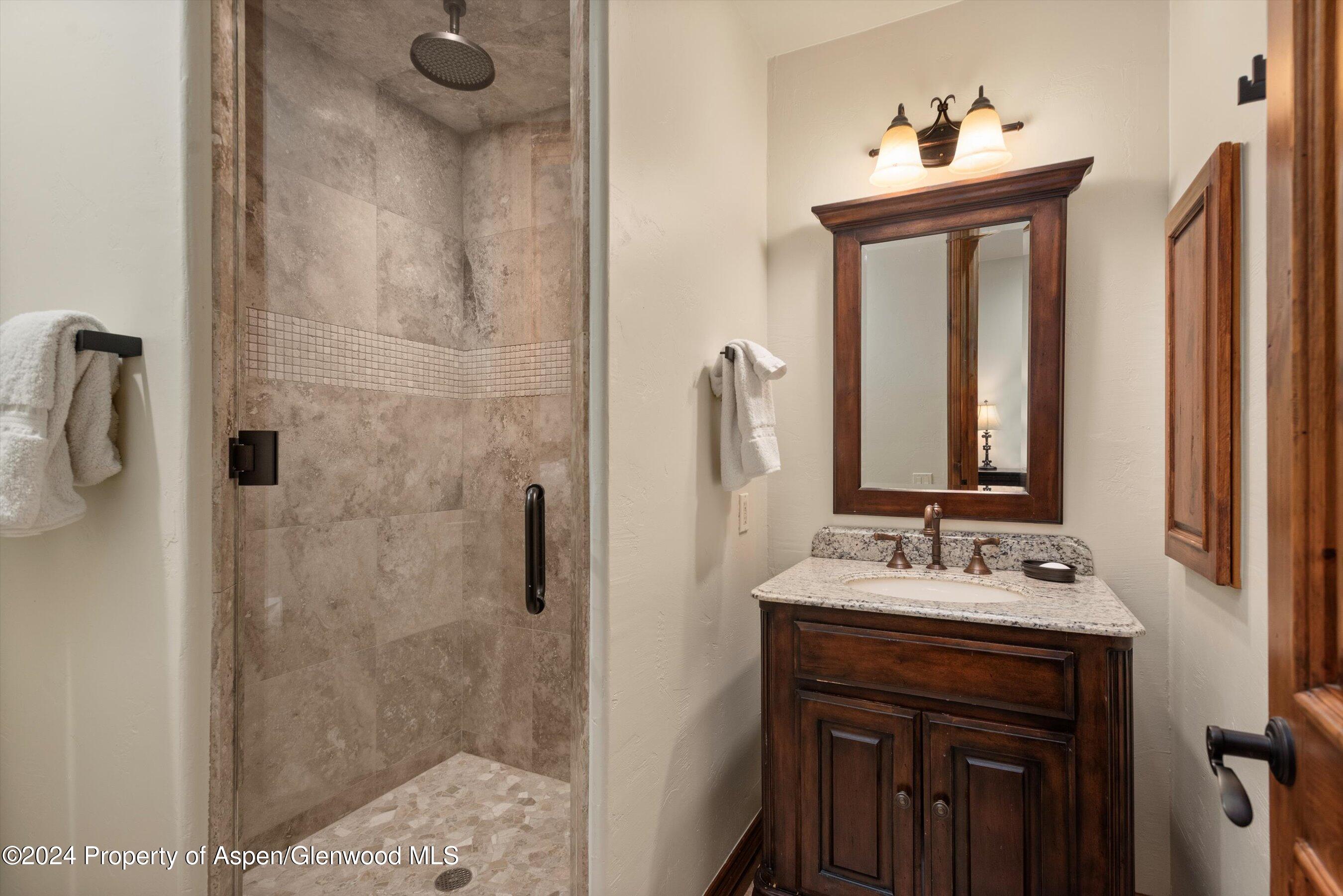 71 Meadow Road Snowmass Village, CO 81615 - Photo 29 of 48 a bathroom with a sink vanity and a mirror