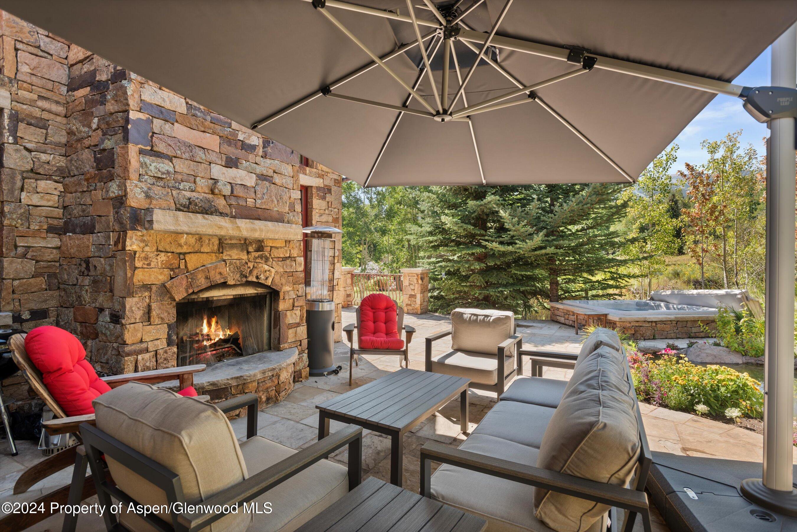71 Meadow Road Snowmass Village, CO 81615 - Photo 37 of 48 a backyard of a house with outdoor seating