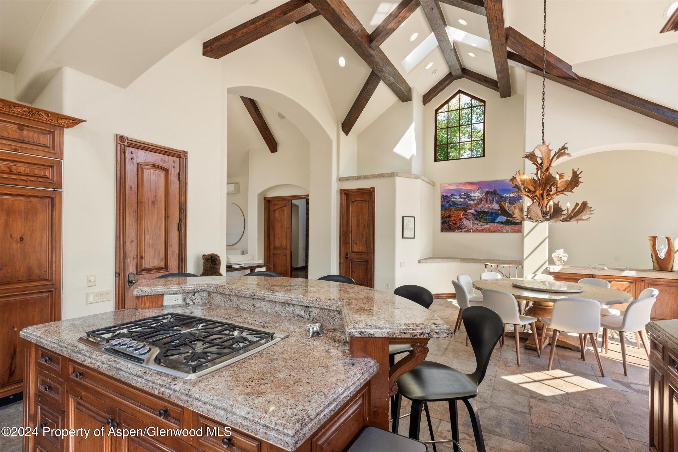 71 Meadow Road Snowmass Village, CO 81615 - Photo 7 of 48 a view of a dining room with furniture and a chandelier