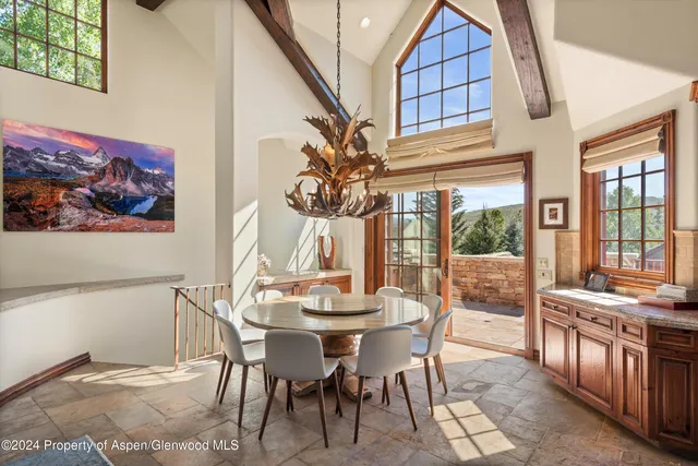 a view of a dining room with furniture window and outside view