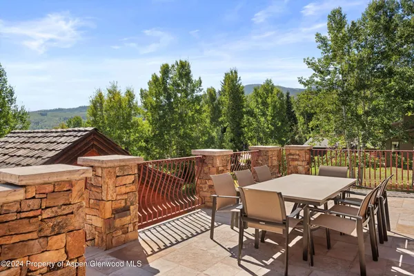 a view of a chairs and table on the terrace