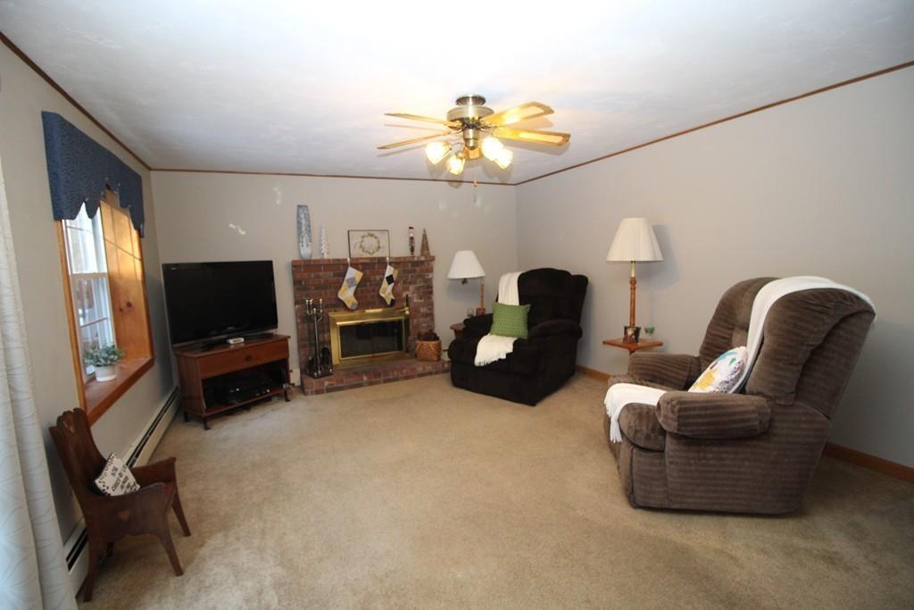 69 Bear Hill Road Gardner, MA 01440 - Photo 11 of 41 a living room with furniture and a flat screen tv