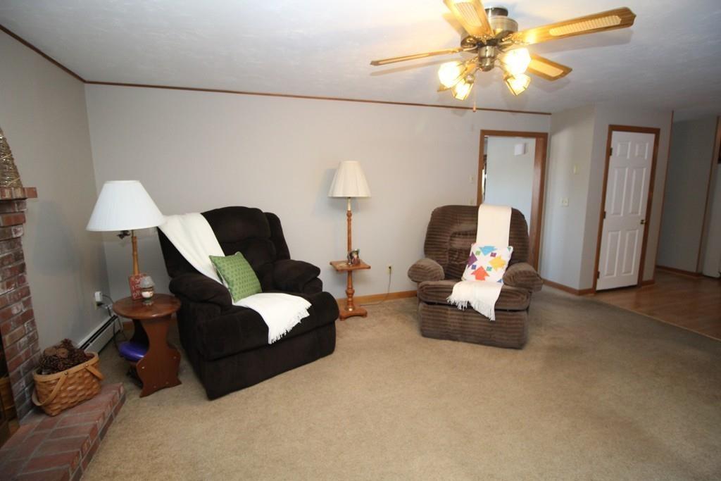 69 Bear Hill Road Gardner, MA 01440 - Photo 12 of 41 a living room with furniture and a chandelier