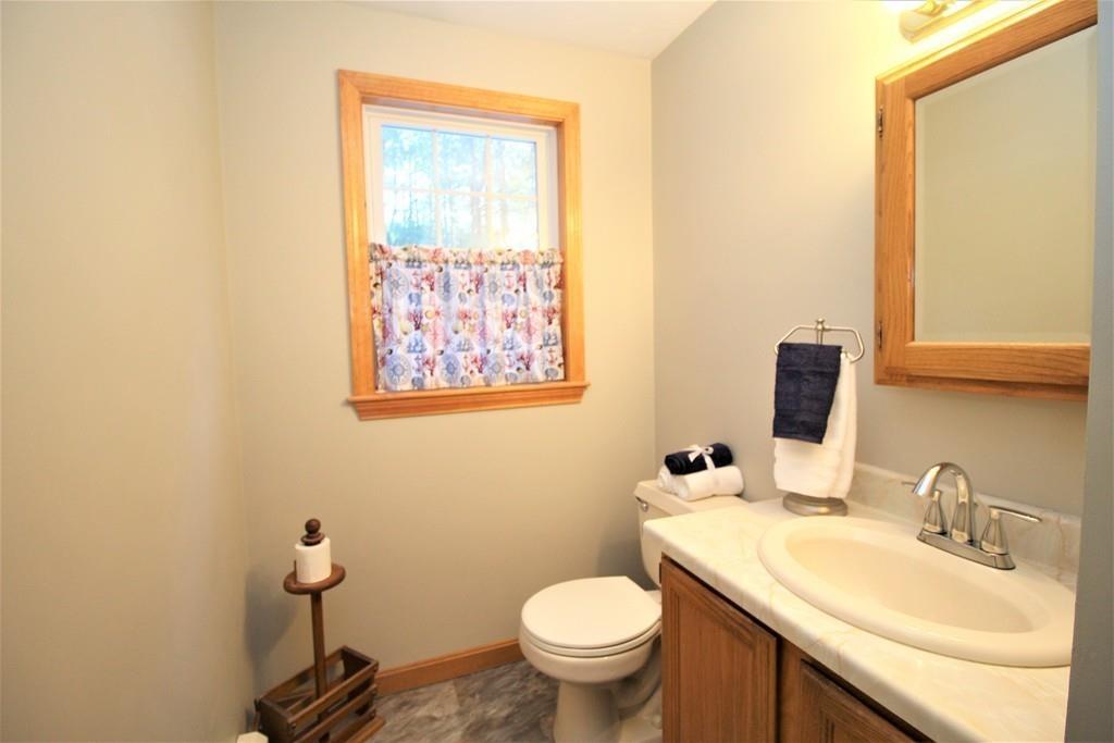 69 Bear Hill Road Gardner, MA 01440 - Photo 14 of 41 a bathroom with a toilet sink and mirror