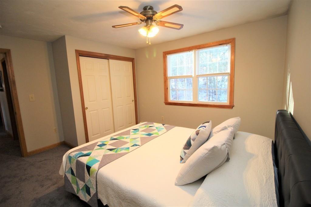 69 Bear Hill Road Gardner, MA 01440 - Photo 19 of 41 a bedroom with a bed and a window