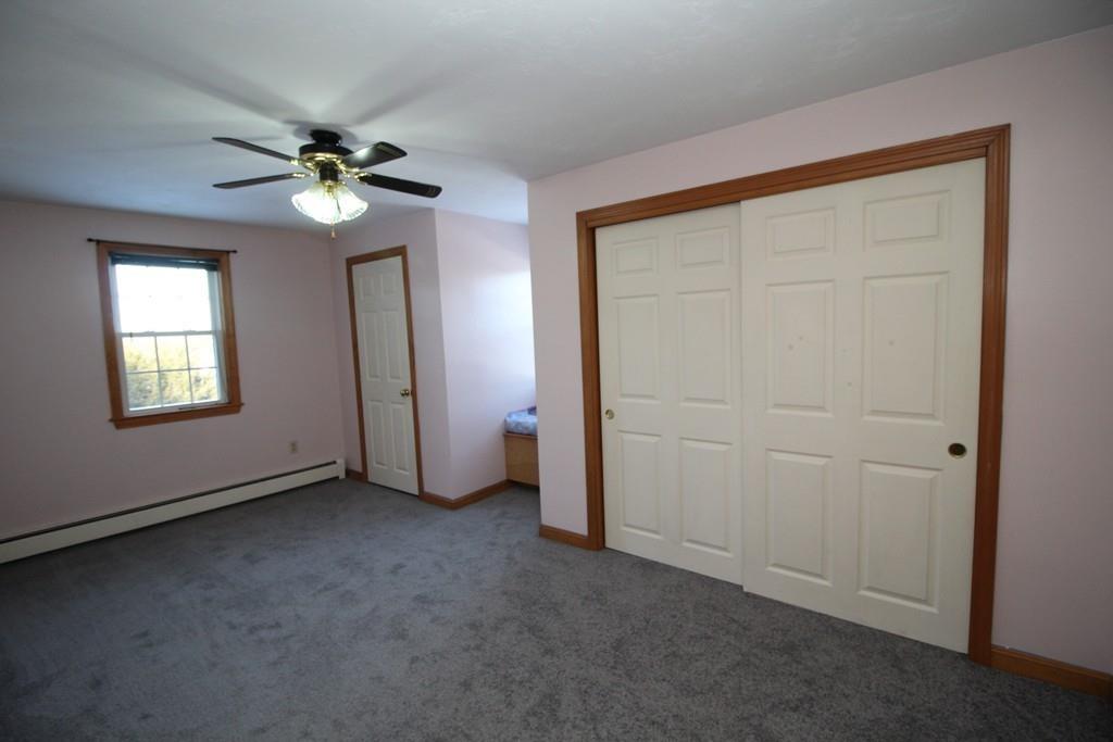 69 Bear Hill Road Gardner, MA 01440 - Photo 20 of 41 an empty room with windows and fan