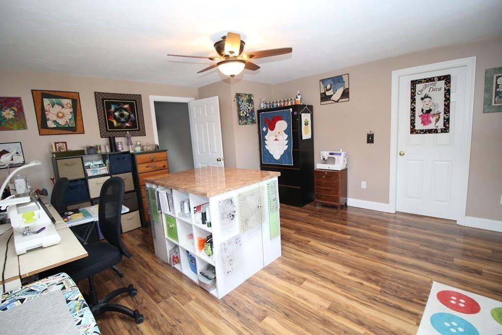 69 Bear Hill Road Gardner, MA 01440 - Photo 28 of 41 a living room with furniture and a flat screen tv