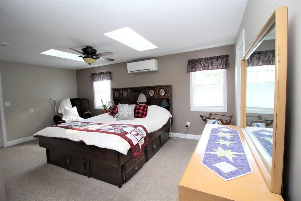 69 Bear Hill Road Gardner, MA 01440 - Photo 30 of 41 a bed sitting in a bedroom next to a window