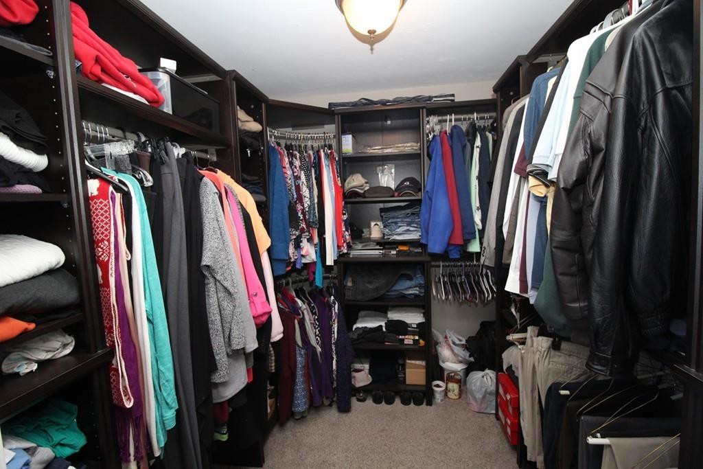 69 Bear Hill Road Gardner, MA 01440 - Photo 33 of 41 a view of walk in closet with clothes and shoes