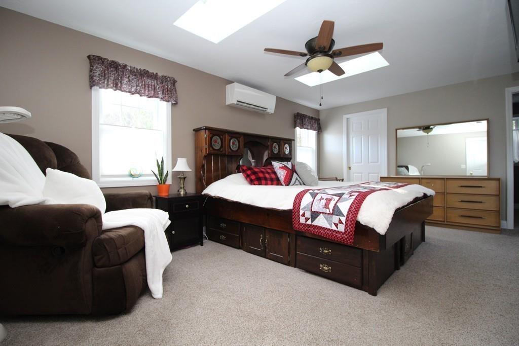 69 Bear Hill Road Gardner, MA 01440 - Photo 34 of 41 a bedroom with a bed couch and window