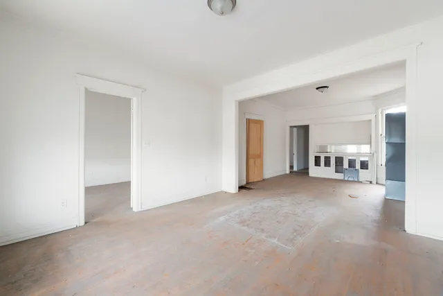 a view of a livingroom with furniture and windows