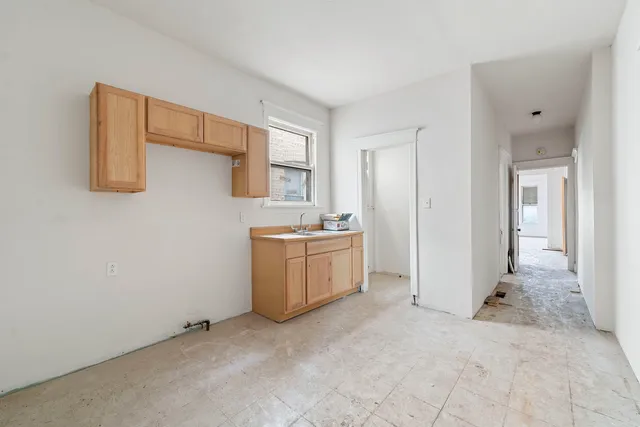 a view of a storage & utility room with a sink
