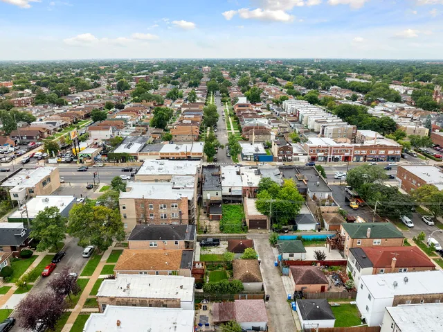 an aerial view of a city with lots of residential buildings