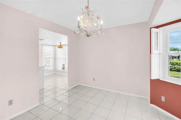 a bathroom with a granite countertop toilet sink and mirror