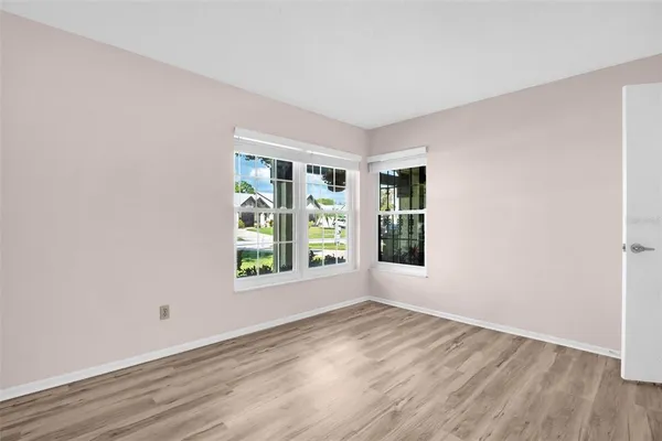 a bathroom with a sink mirror and a shower