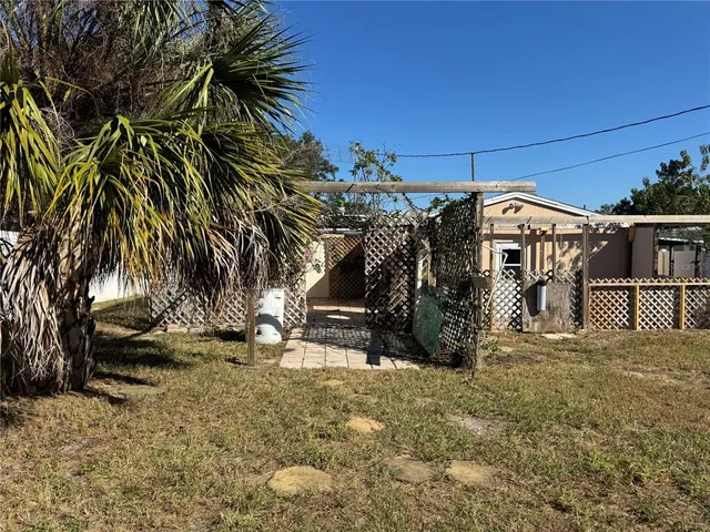 a view of a backyard of a house