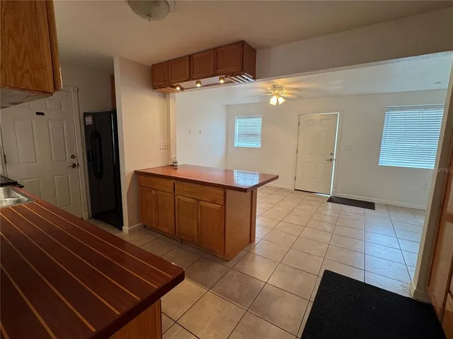 a kitchen with stainless steel appliances a refrigerator and a stove