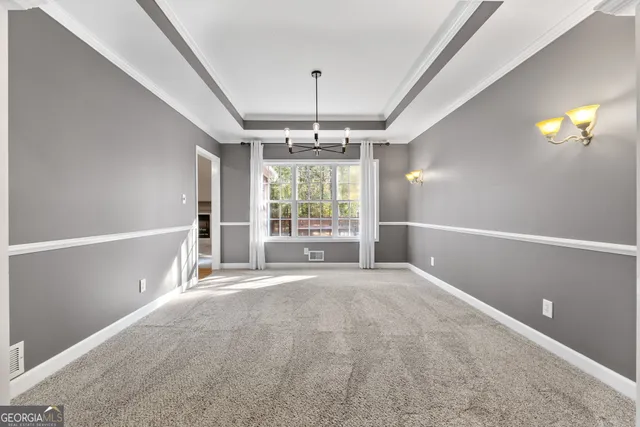 a spacious bathroom with a granite countertop sink and a mirror