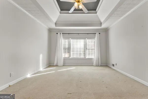 a bathroom with a sink vanity mirror and toilet