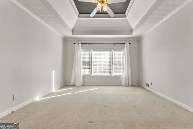 a bathroom with a sink vanity mirror and toilet