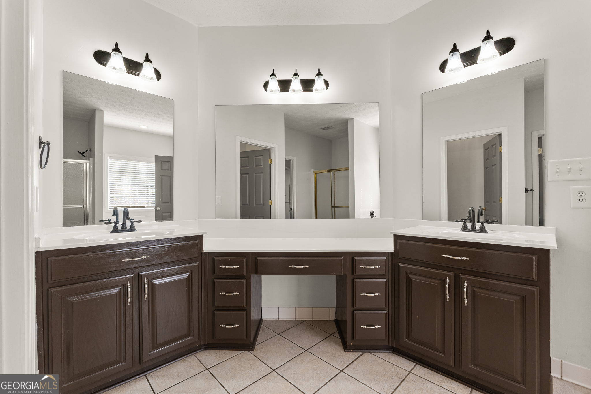 400 Moseley Road Stockbridge, GA 30281 - Photo 22 of 70 a spacious bathroom with a granite countertop sink and a mirror