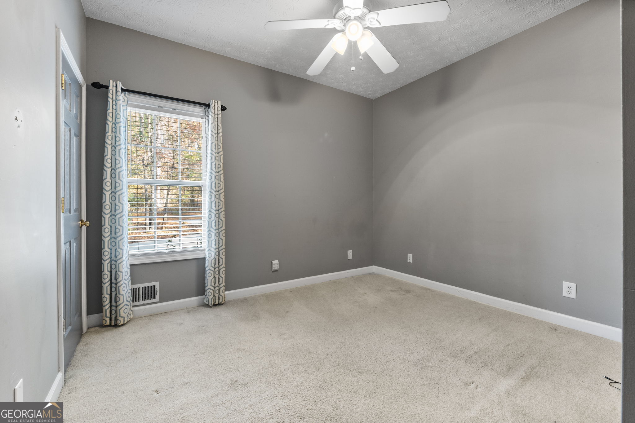 400 Moseley Road Stockbridge, GA 30281 - Photo 25 of 70 a view of an empty room with a window