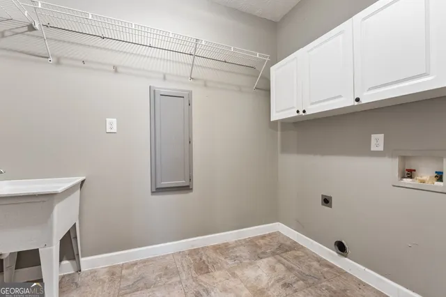 a view of empty room with closet and bathroom
