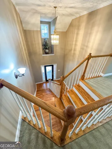 an empty room with closet and a chandelier fan