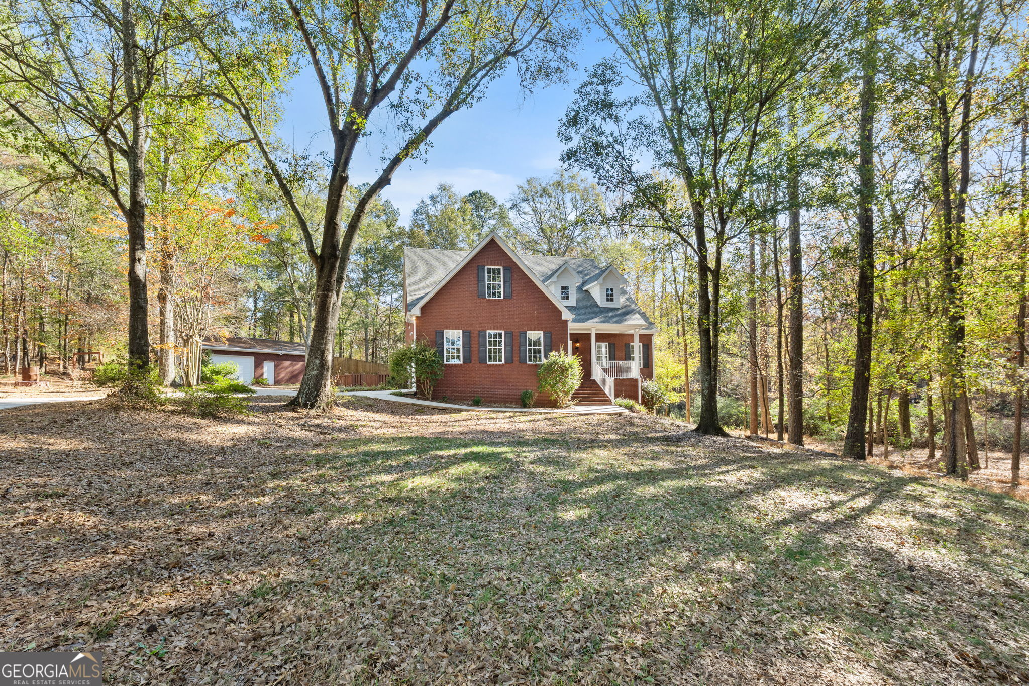 400 Moseley Road Stockbridge, GA 30281 - Photo 3 of 70 a house with trees in front of it
