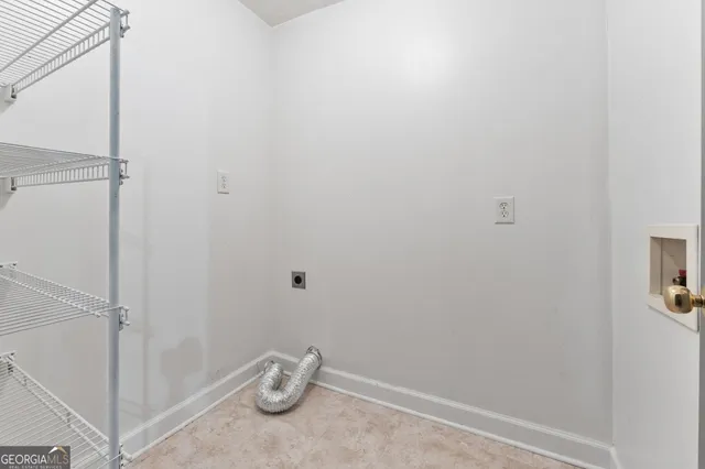 a view of a kitchen with a sink and cabinets