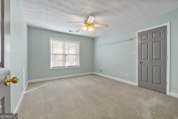 a bathroom with a sink double vanity mirror and a bathtub