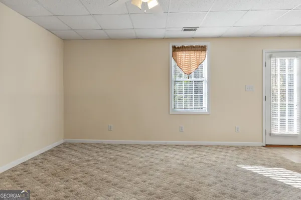a view of a backyard with large trees